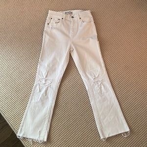 DAZE ripped white jeans.